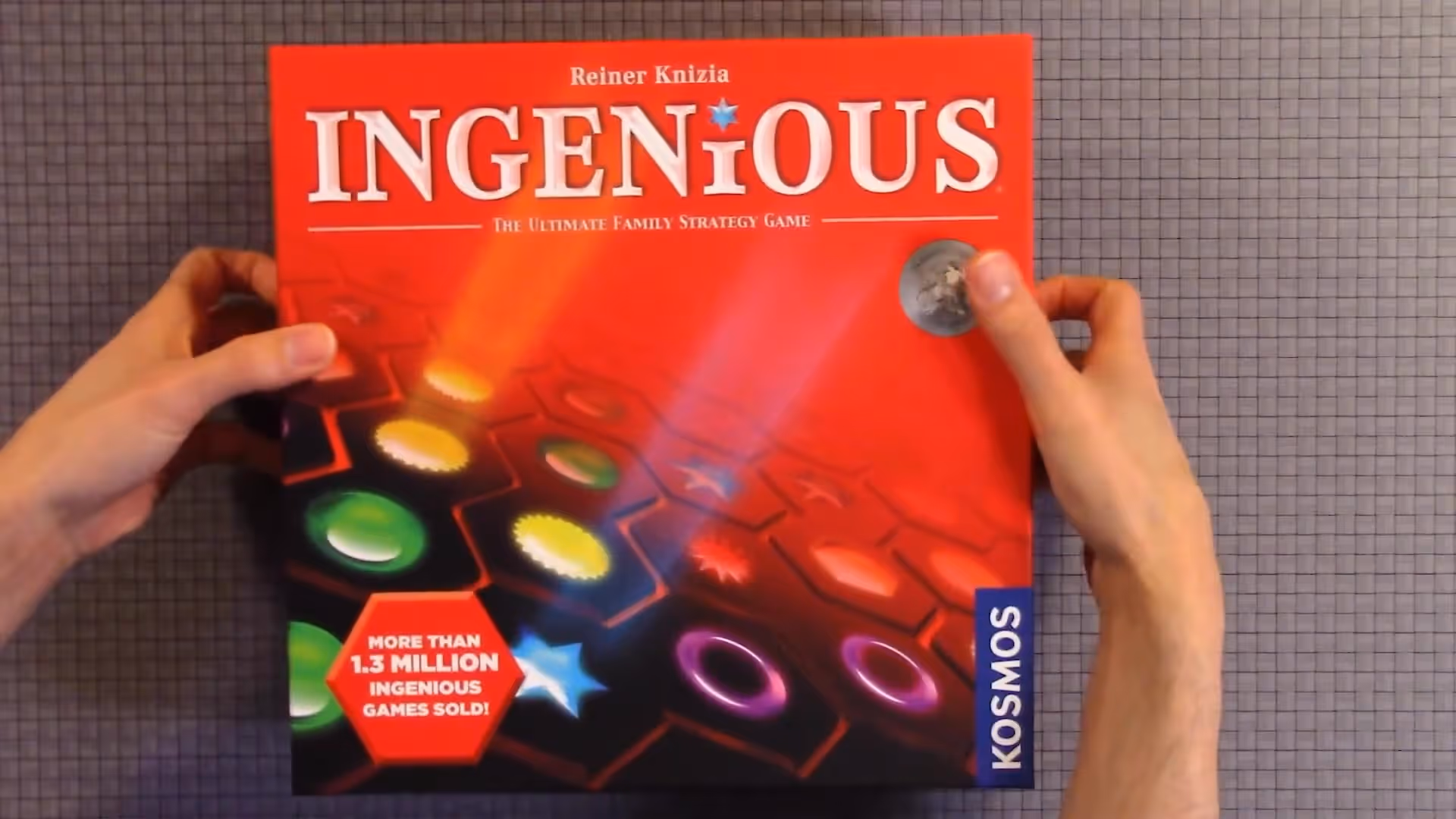 Ingenious game box held by hands
