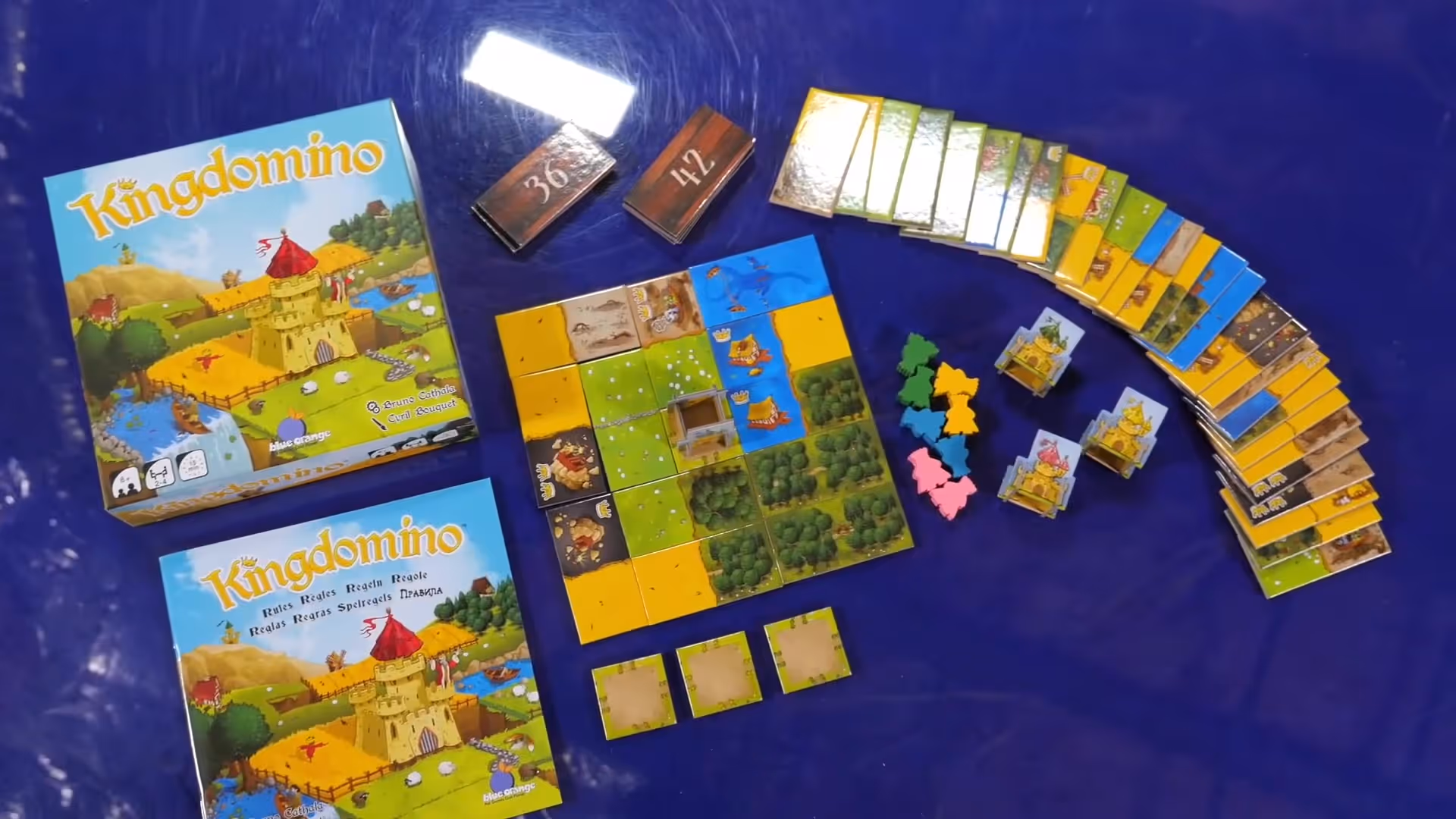 Kingdomino board game components laid out on a table
