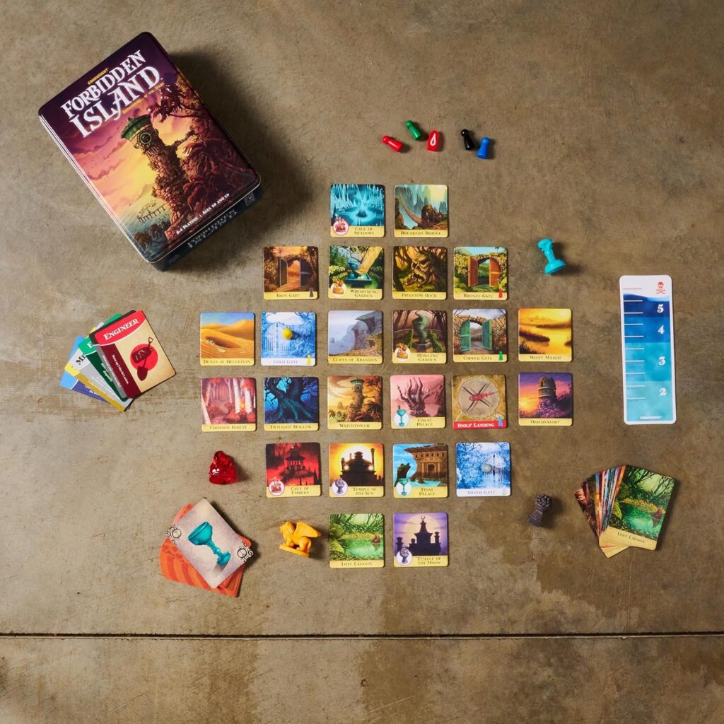 Forbidden Island board game components spread out on a table, including the game box, cards, player pawns, and tiles