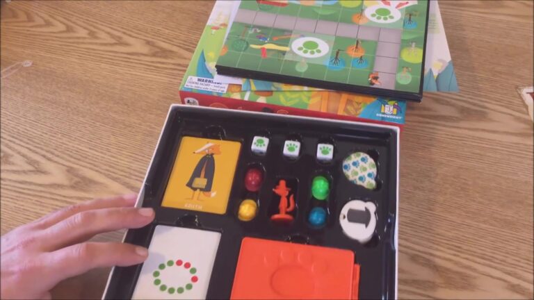 Opened outfoxed board game box showing various game components including cards with animal illustrations, colored pawns, dice with paw prints, and a game board.