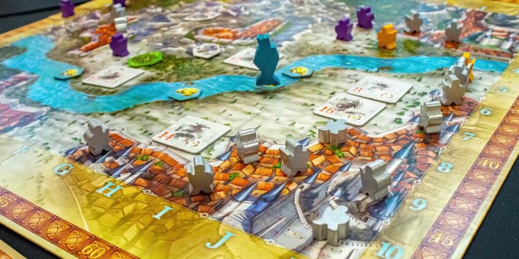 Adventure Land board game displayed with board, character cards, dice, and tokens arranged to showcase game components