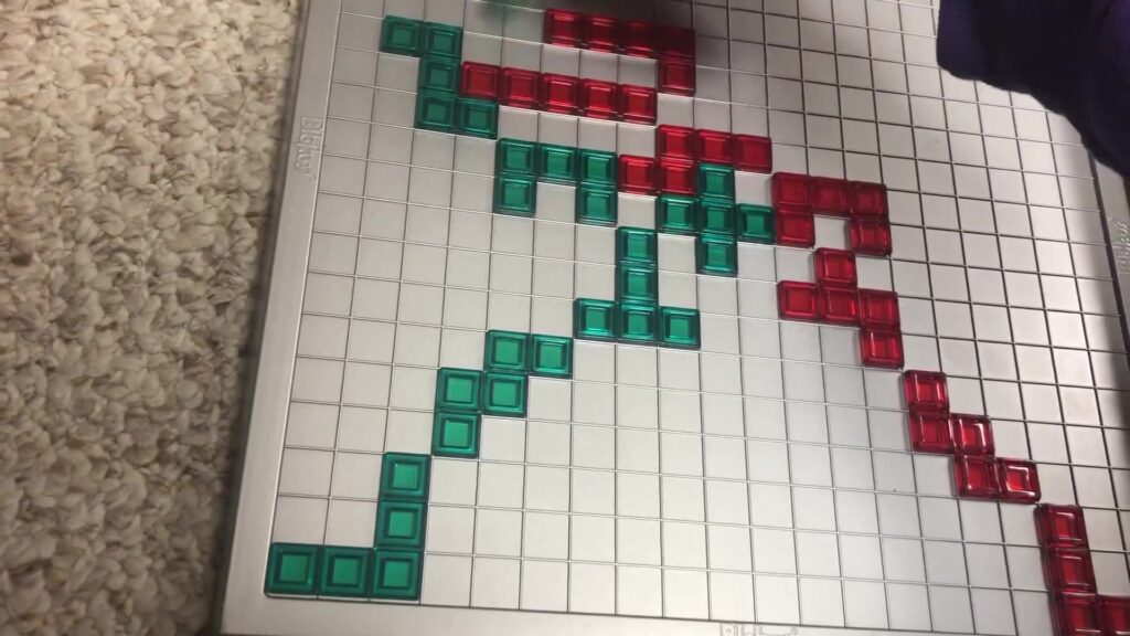 Blokus board game components including colorful pieces and a game board