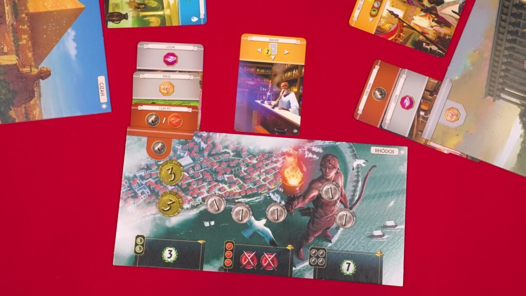 Close-up of 7 Wonders game cards and player board featuring Rhodes.