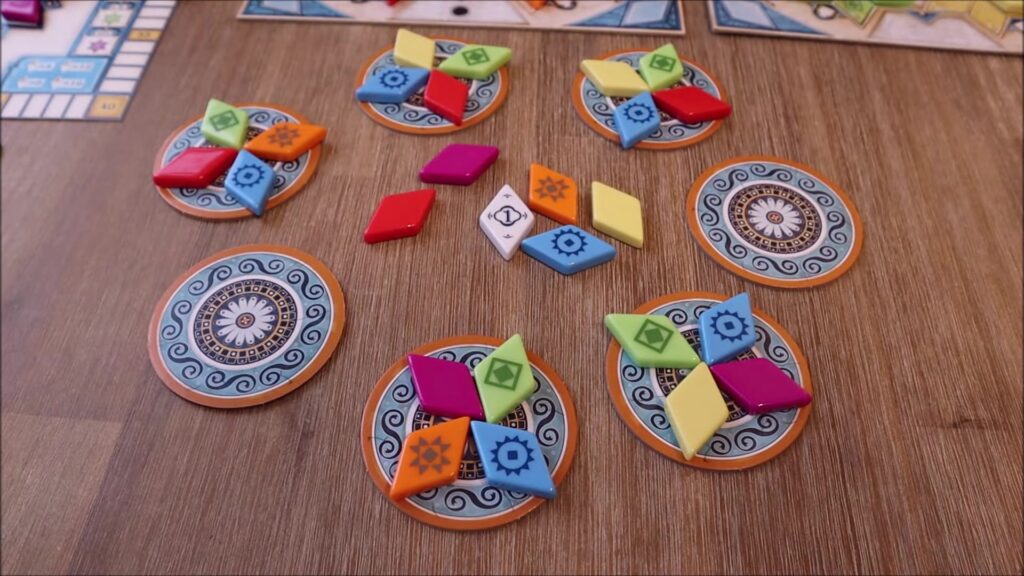 Tiles and game components on a table.
