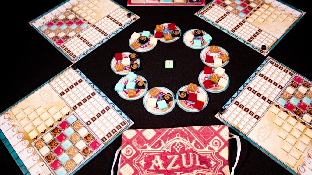 Azul: Master Chocolatier board game setup with player boards and factory displays.