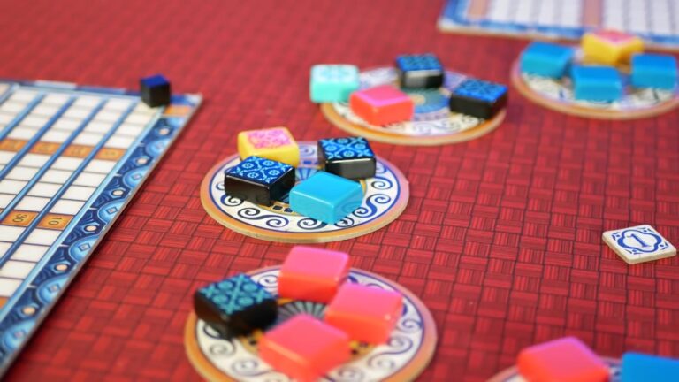 Azul game in progress with colorful tiles on factory displays.