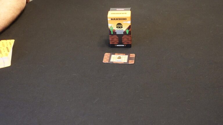 Bandido game box and card on dark surface