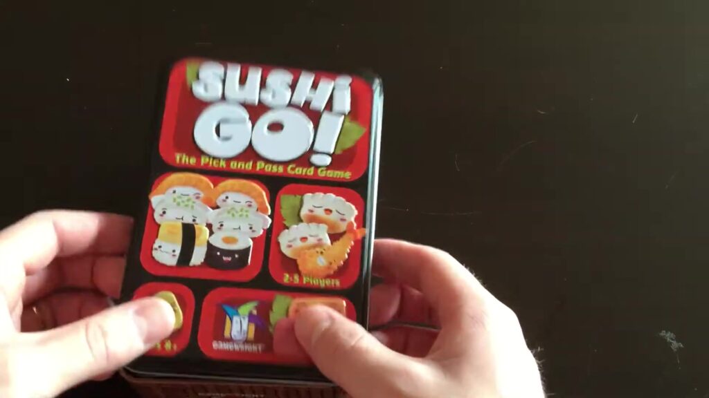 Sushi Go ! card game box featuring colorful sushi illustrations