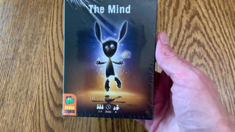 The Mind card game box featuring a rabbit-like character holding a card, with mystical background and game details